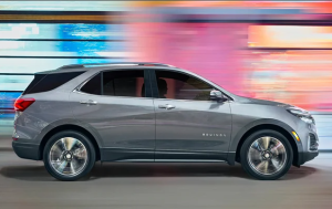A 2023 Chevy Equinox driving down a city street near Parsons, Kansas.