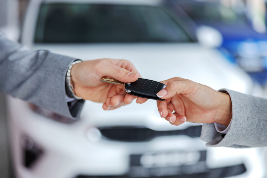 A person receiving the key to a new Chevrolet near Parsons, KS